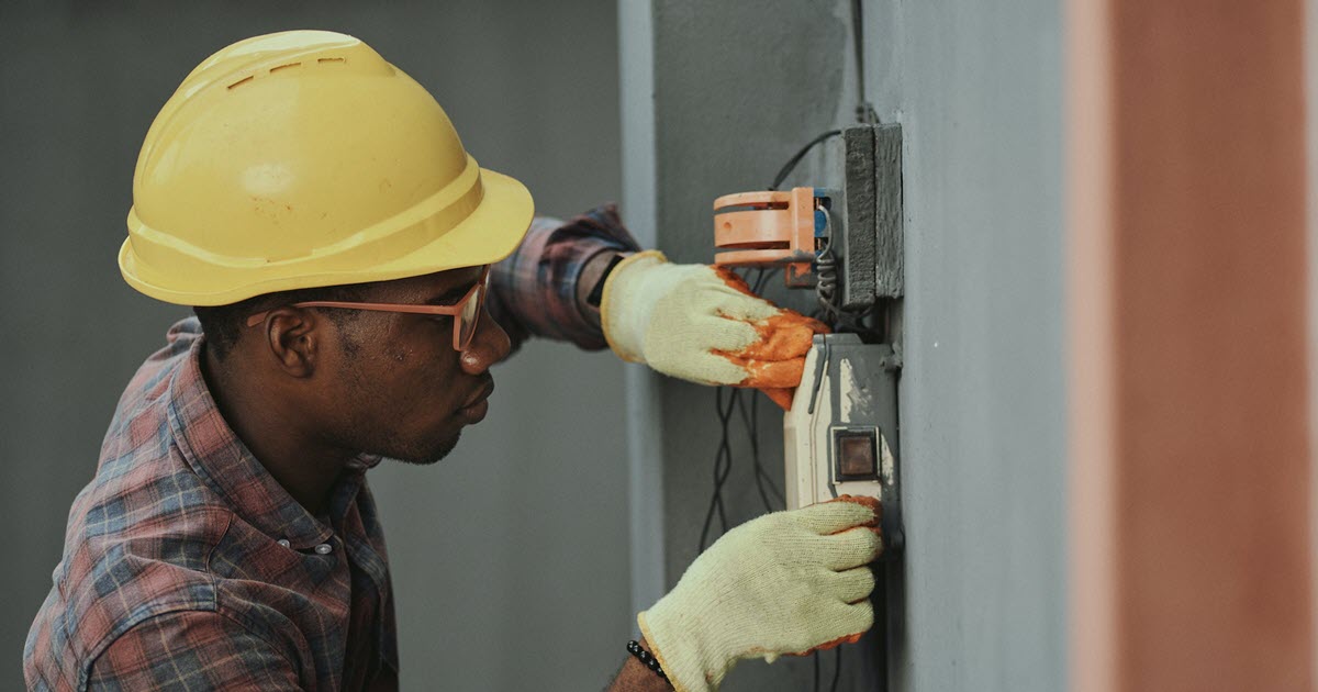 Electrical worker taking safety precautions