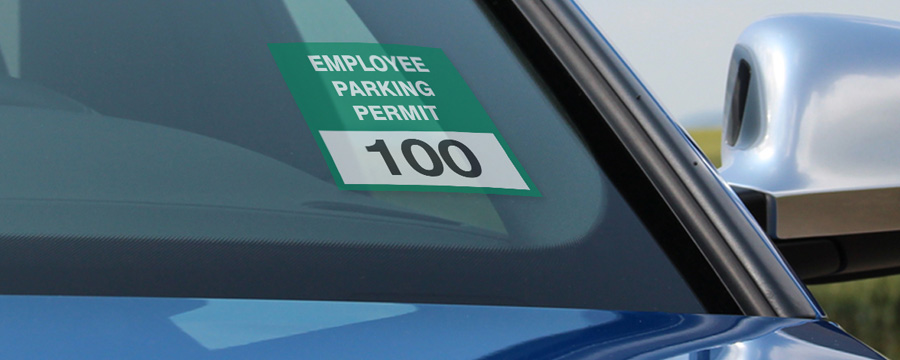 Employee parking permit on car windshield