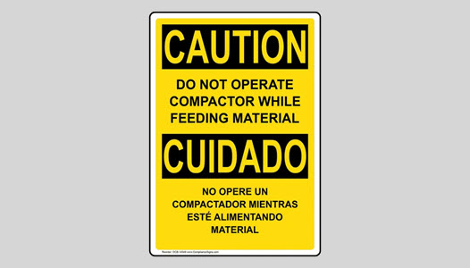 OSHA CAUTION sign with compactor safety tip