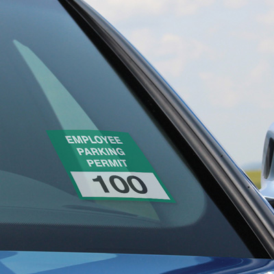 Parking permit window cling applied to car windshield