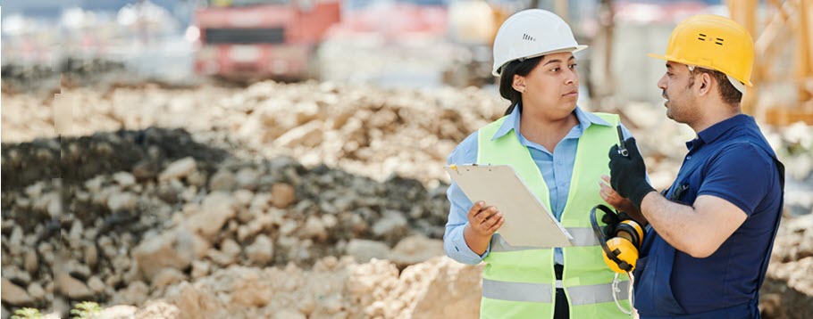 Workers discussing PPE needs